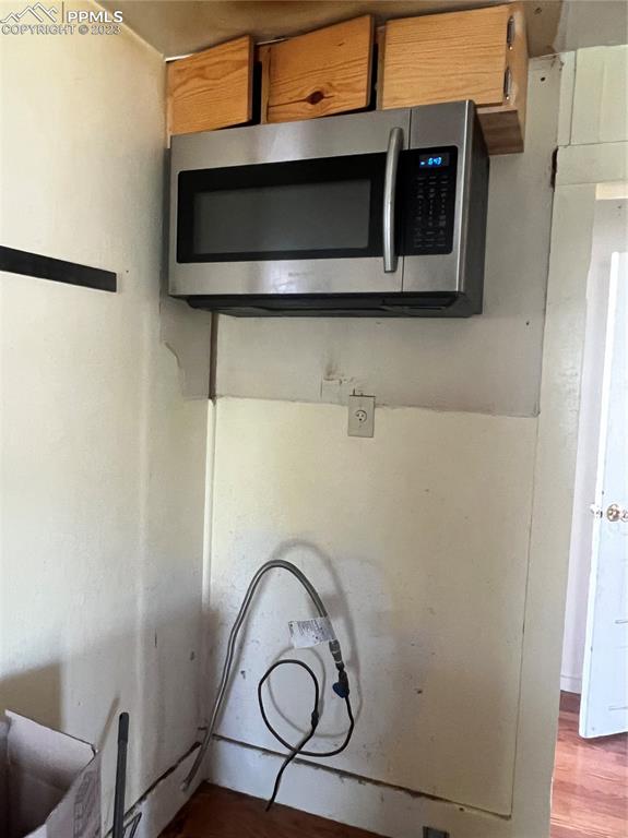955 Golden Street Calhan, CO 80808 - Photo 16 of 25 a bathroom with a sink and a microwave
