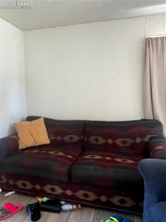 955 Golden Street Calhan, CO 80808 - Photo 23 of 25 a living room with furniture and a flat screen tv