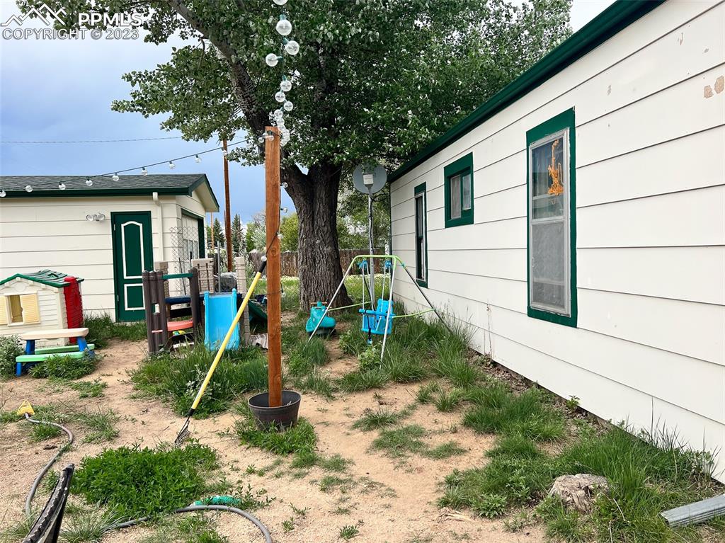955 Golden Street Calhan, CO 80808 - Photo 5 of 25 a view of a house with a yard