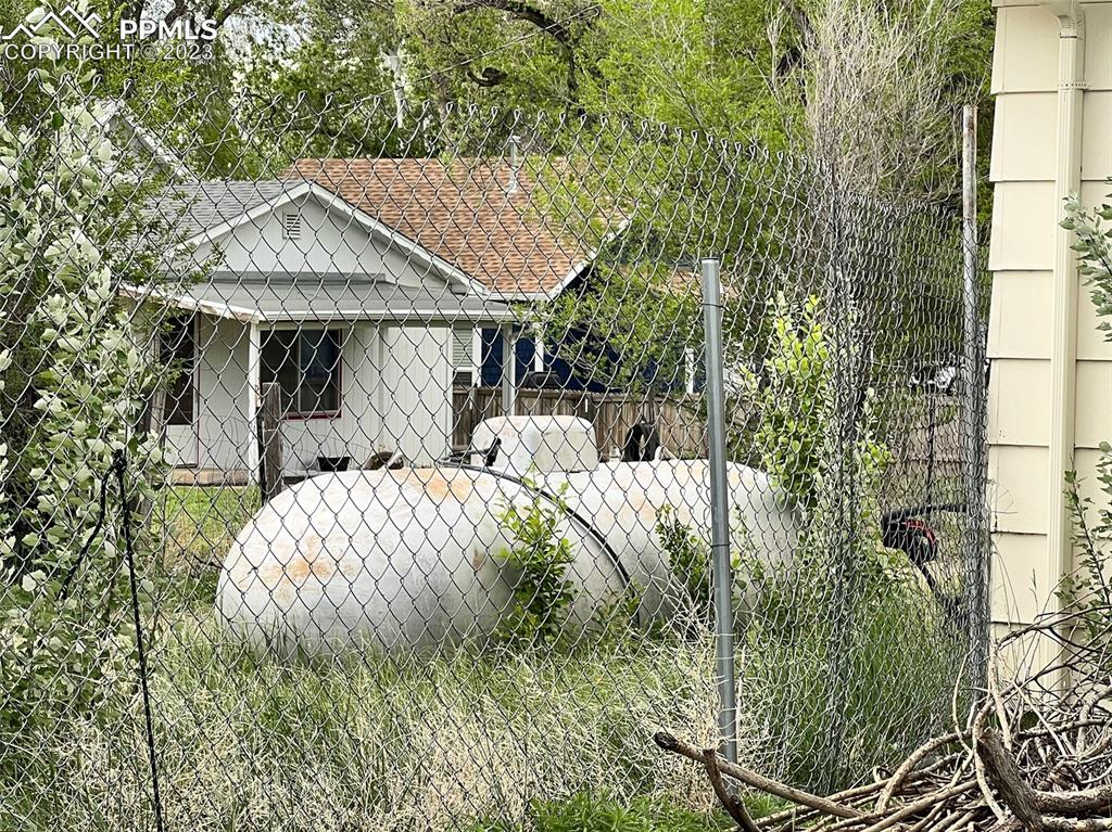 955 Golden Street Calhan, CO 80808 - Photo 6 of 25 a front view of a house with garden