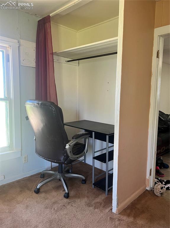 955 Golden Street Calhan, CO 80808 - Photo 10 of 25 a view of a workspace with furniture and a window