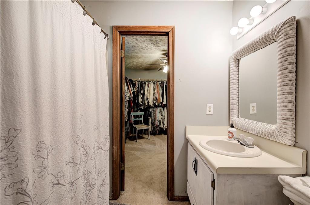 3637 Nebo Road Hiram, GA 30141 - Photo 42 of 63 a en suite bathroom with a sink and a mirror
