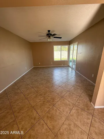 a view of an empty room and a window