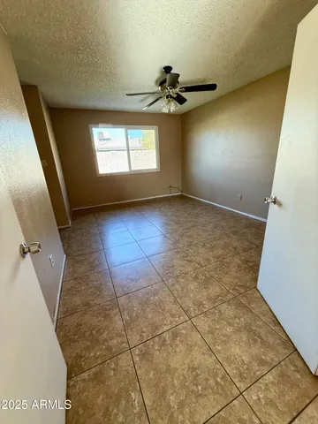 a view of a house with backyard and porch