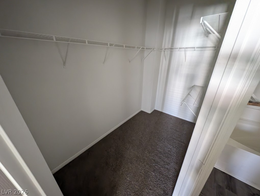 10550 West Alexander Road, Unit 2117 Las Vegas, NV 89129 - Photo 17 of 24 Ample closet space features plush carpeting and wire shelving.
