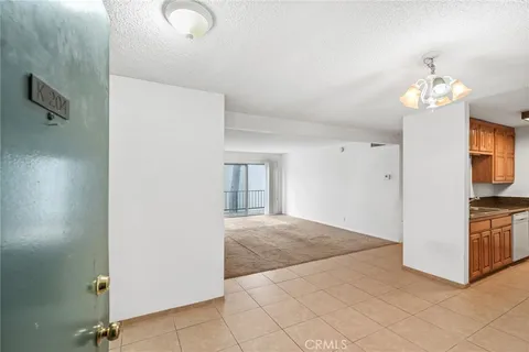a view of a kitchen from the hallway
