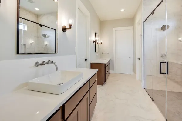 a bathroom with a sink vanity and a mirror