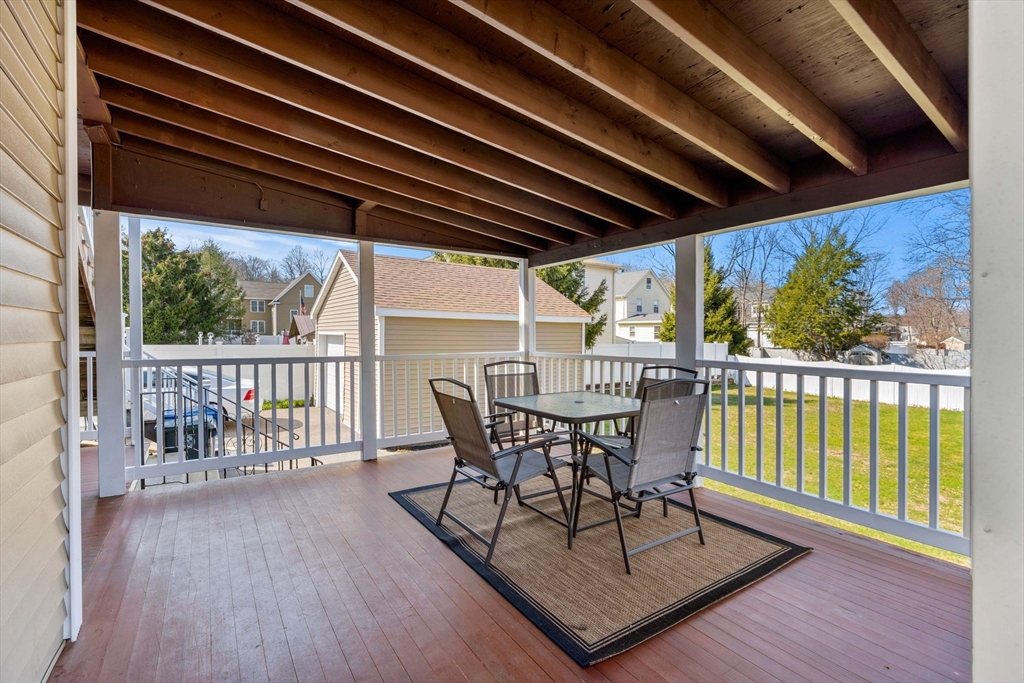 12 Chestnut Street Danvers, MA 01923 - Photo 10 of 25 a view of balcony with wooden floor and outdoor seating