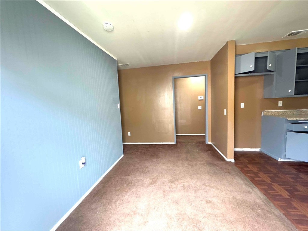 202 East Jackson Street, Unit B Rialto, CA 92376 - Photo 2 of 7 a view of a big room with closet and windows