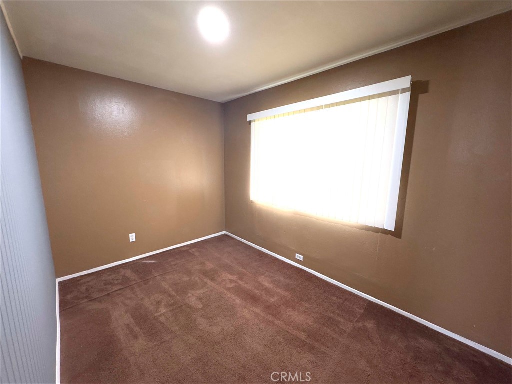 202 East Jackson Street, Unit B Rialto, CA 92376 - Photo 4 of 7 an empty room with a window