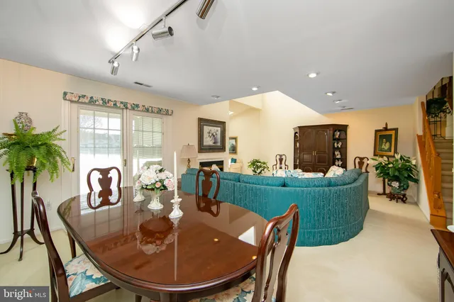 a dining room with furniture and window