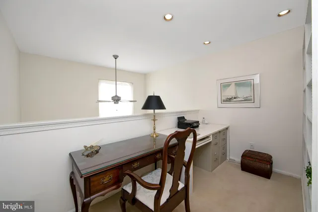 a view of a workspace with furniture