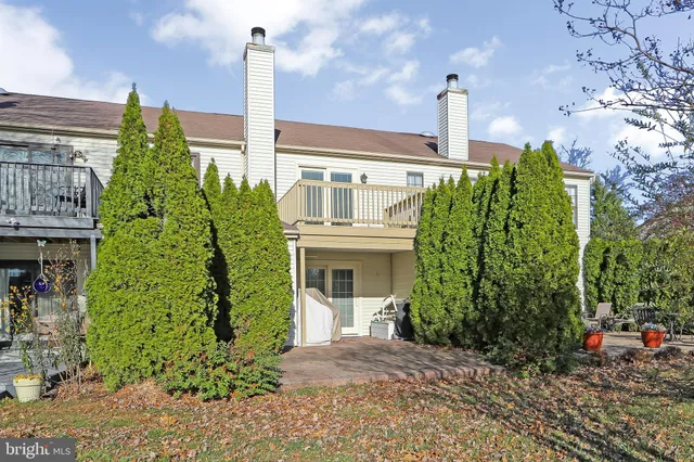 a front view of a building with garden
