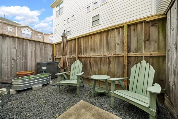 a view of a chairs setting on the roof deck