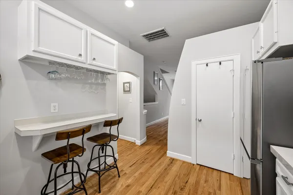 a kitchen with stainless steel appliances a refrigerator and a stove