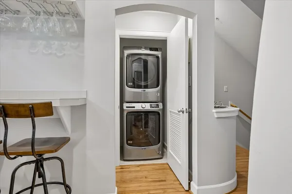 a bathroom with a washing machine and a shower