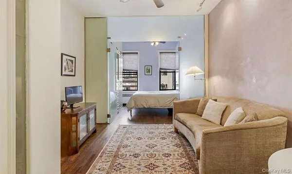 a living room with furniture and a rug