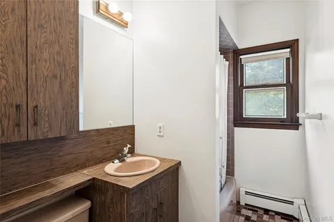a bathroom with a sink and a mirror