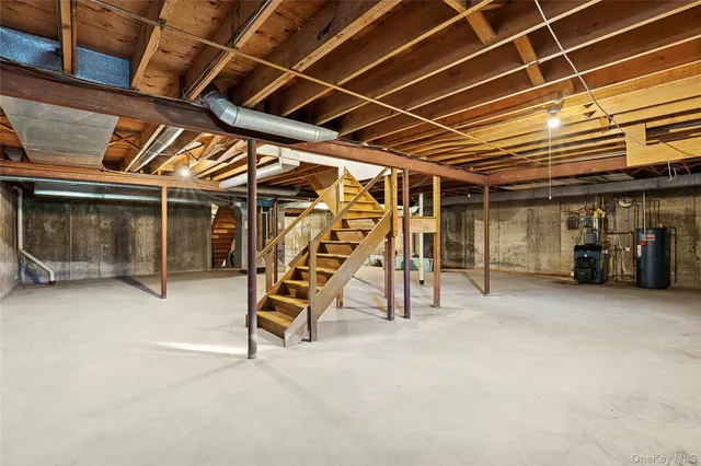 a view of a room with wooden stairs
