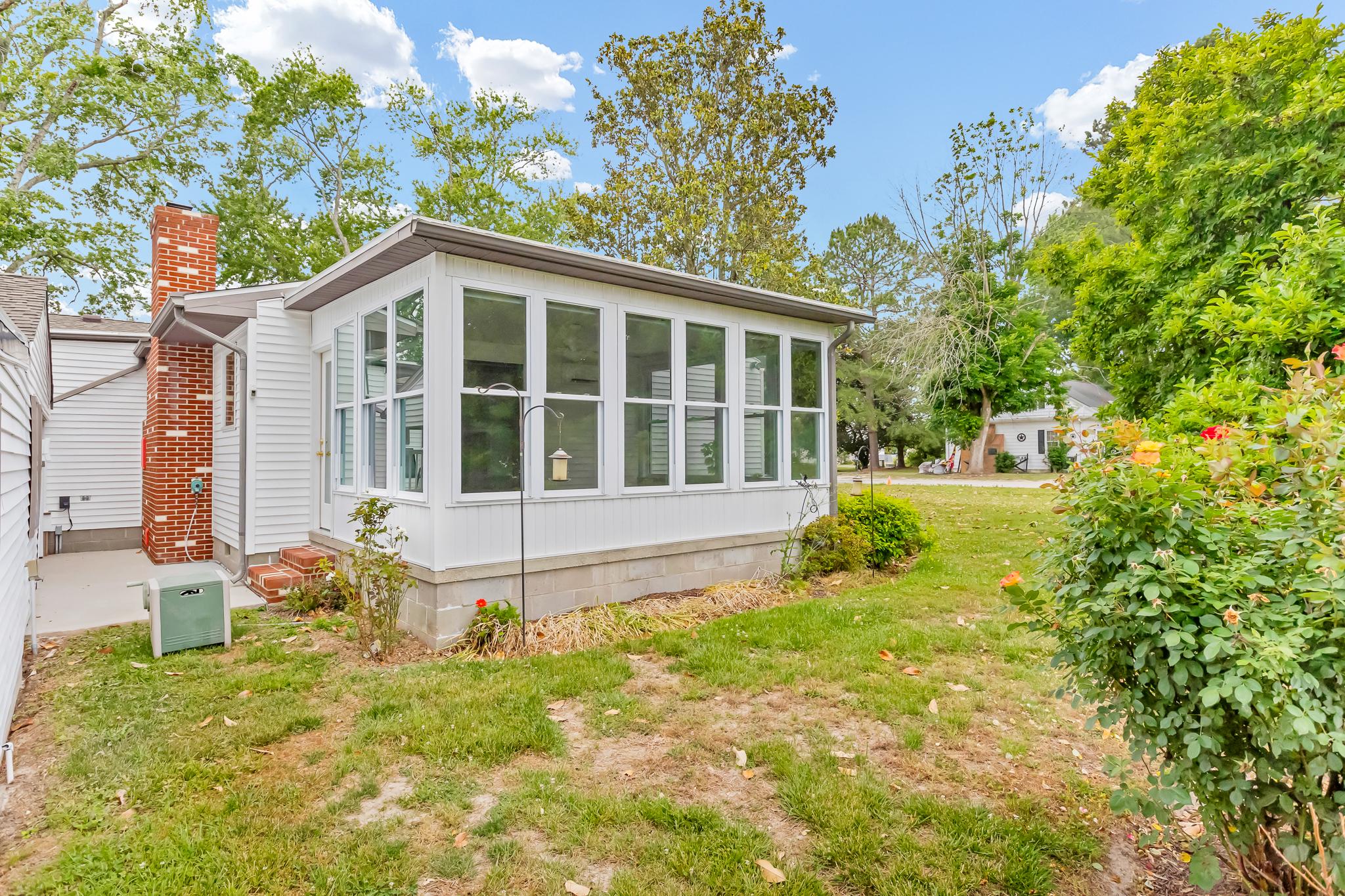 11163 Stewart Neck Road Princess Anne, MD 21853 - Photo 48 of 80 Rear of Sunroom & Pathway between carport.
