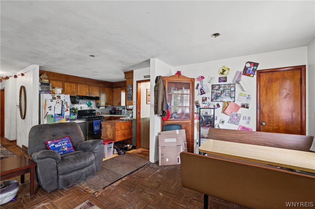 8435 Rochester Road Royalton, NY 14067 - Photo 7 of 27 Hardwood parquet floors run throughout this versat