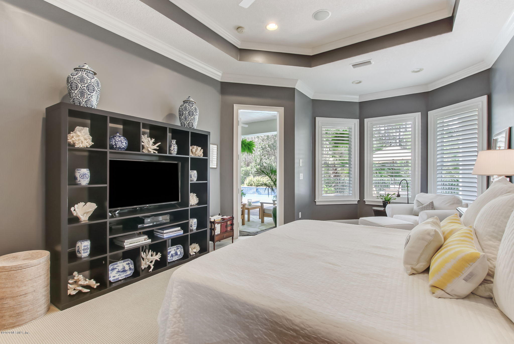 28 Lighthouse Point Circle Ponte Vedra, FL 32081 - Photo 30 of 108 a bedroom with furniture and a flat screen tv