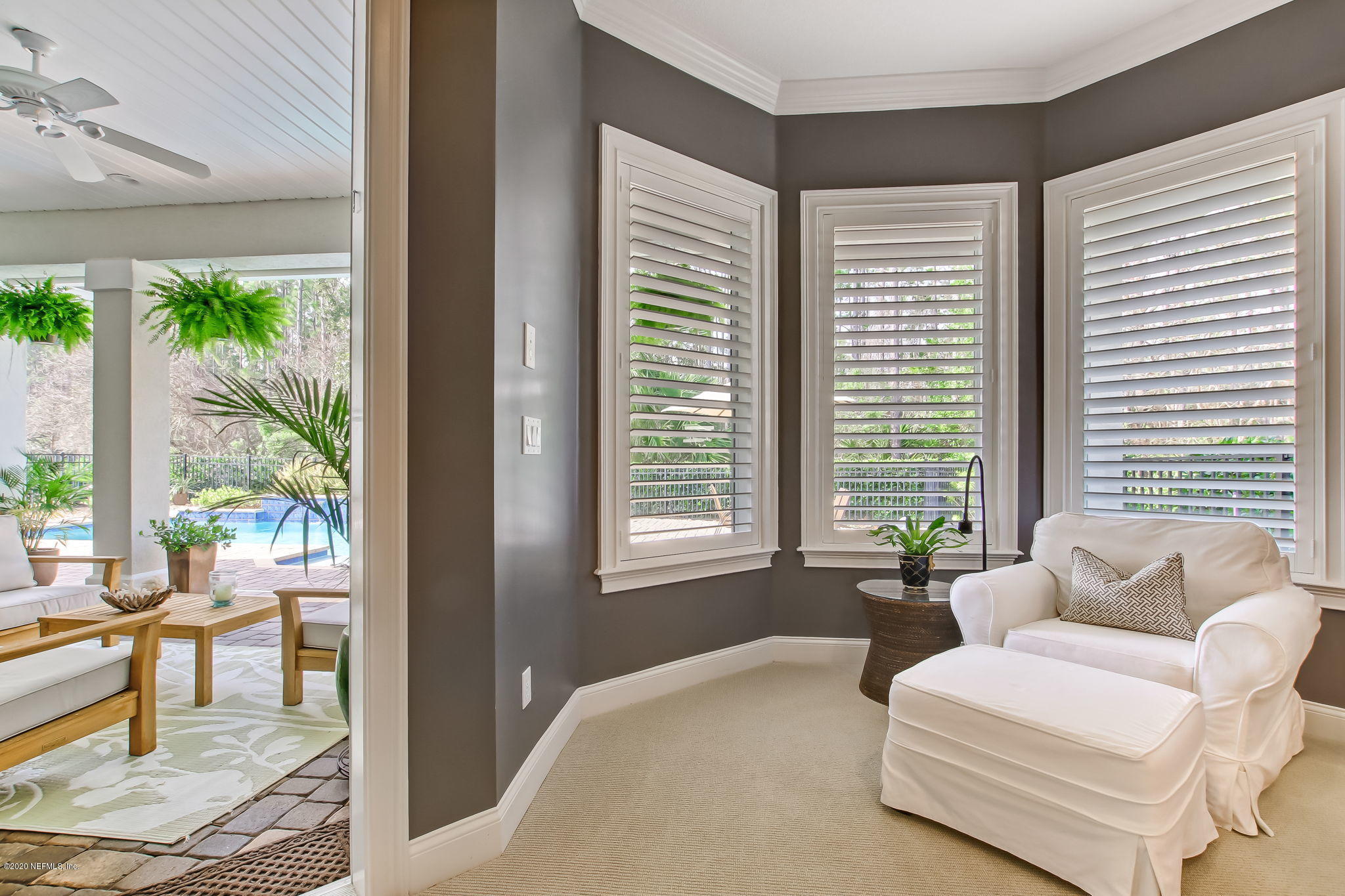 28 Lighthouse Point Circle Ponte Vedra, FL 32081 - Photo 31 of 108 a living room with furniture and a large window