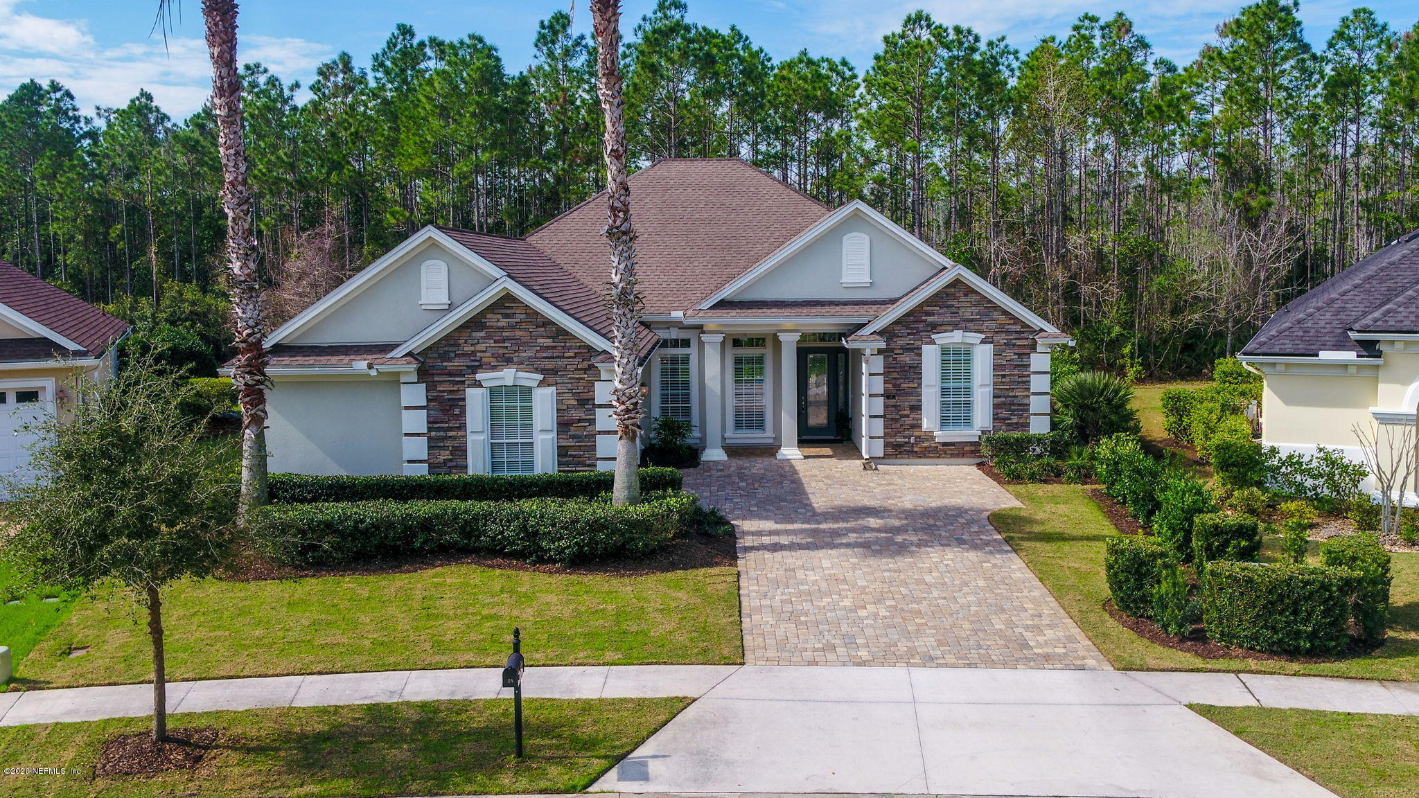 28 Lighthouse Point Circle Ponte Vedra, FL 32081 - Photo 79 of 108 a front view of a house with a garden