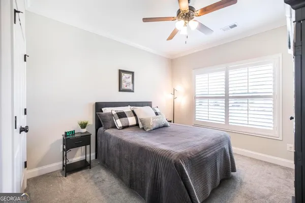 a bedroom with a bed and a walk in closet