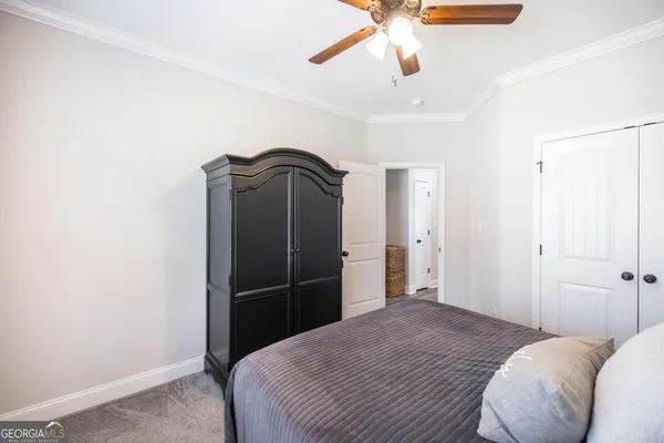 a bathroom with a sink a toilet and shower curtain