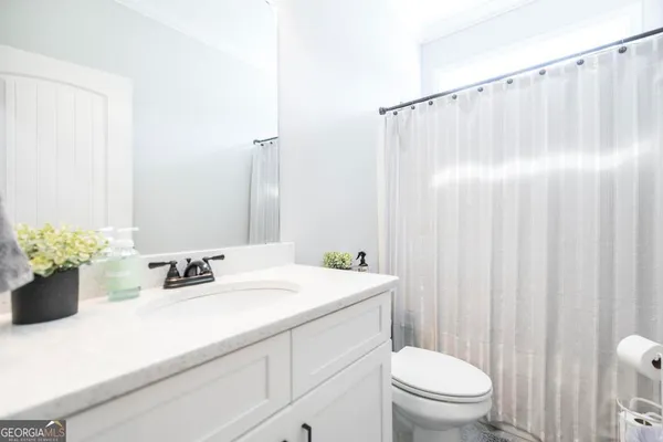 a bedroom with a bunk bed and a window