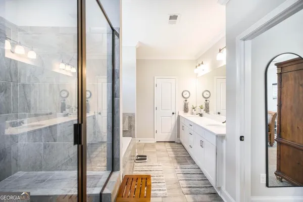 a bathroom with a glass shower door