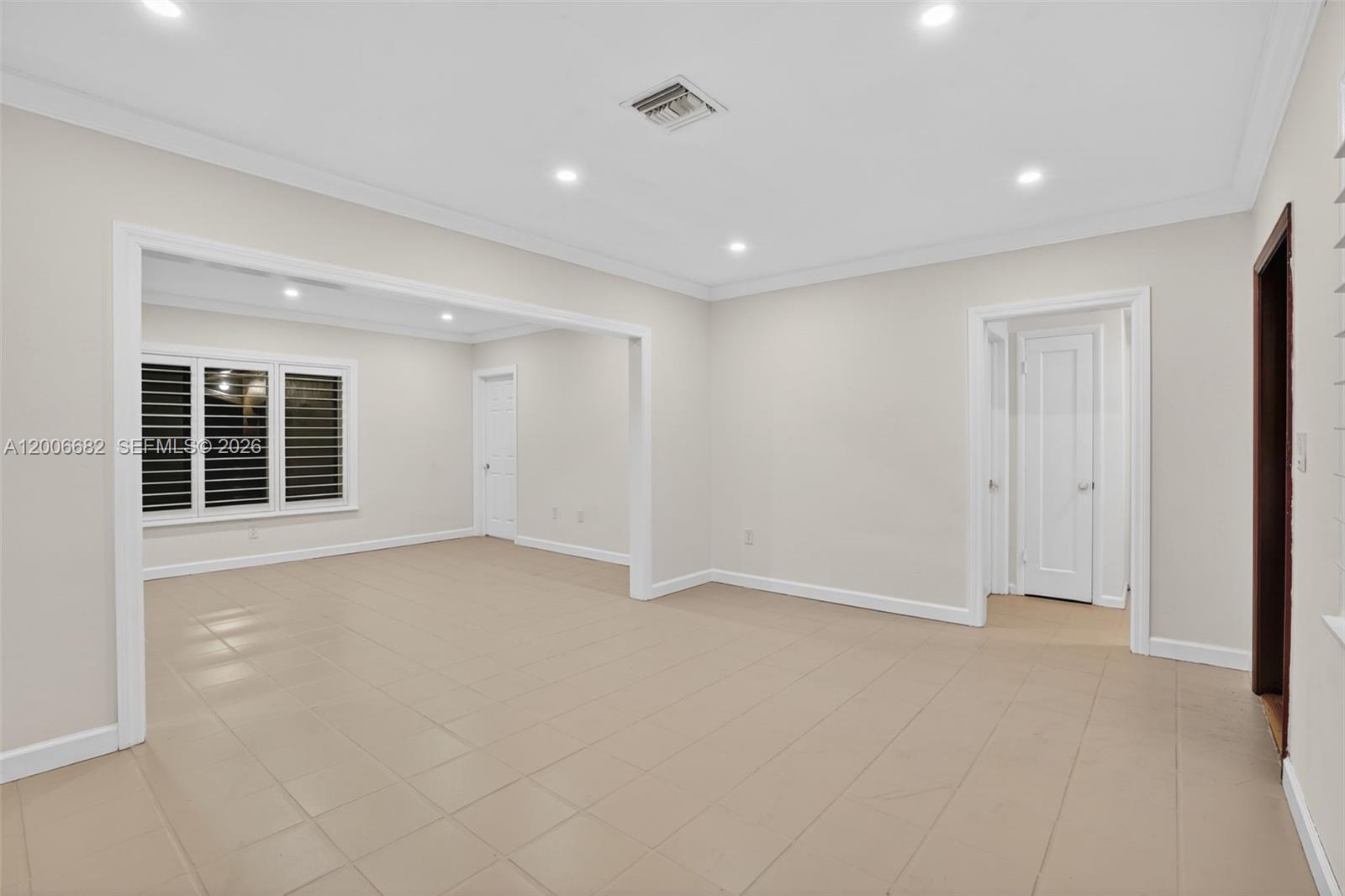 1435 Blue Road Coral Gables, FL 33146 - Photo 7 of 31 a view of an empty room with a window