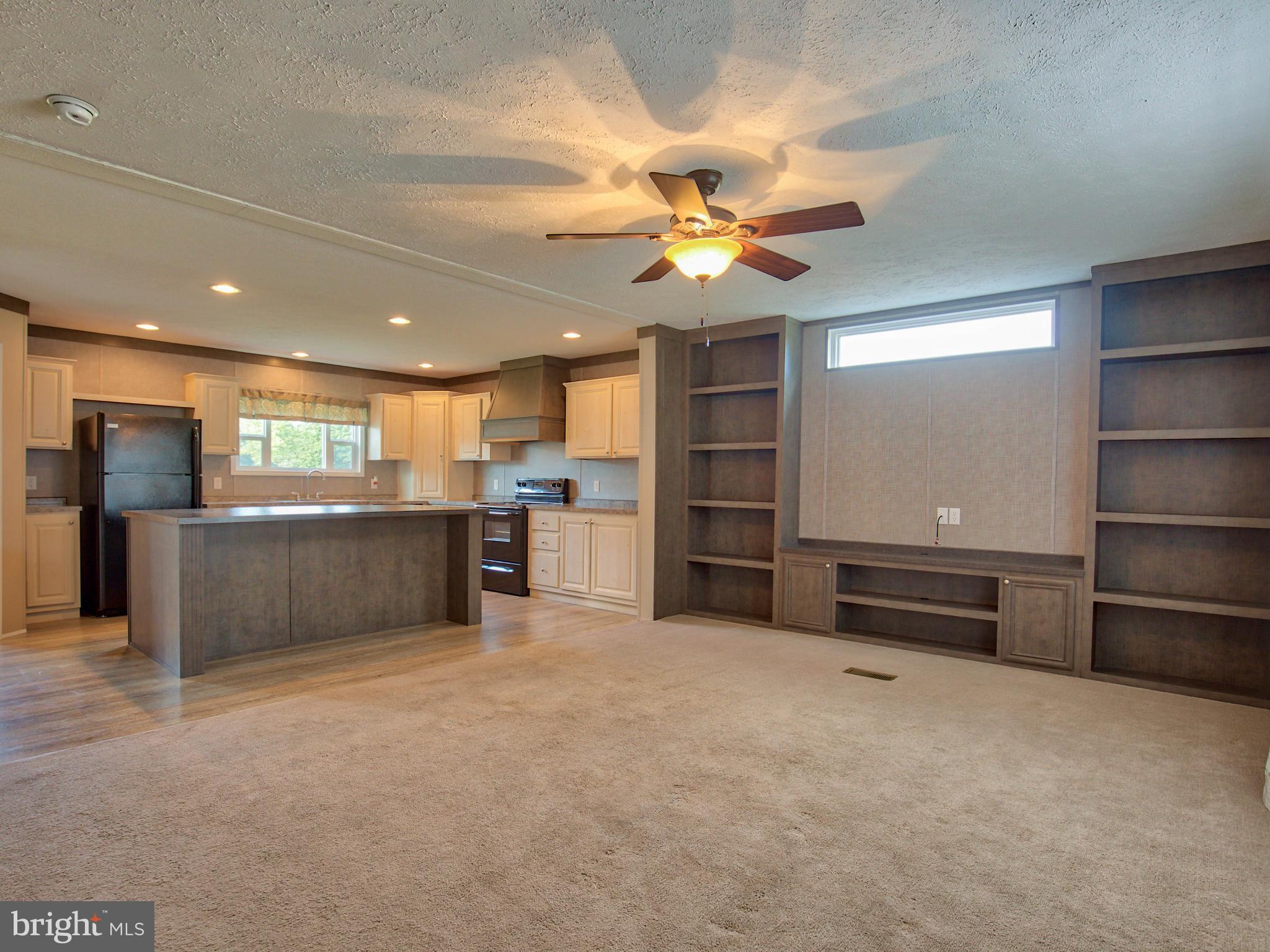 2091 Hatchery Road Inwood, WV 25428 - Photo 8 of 30 Living Room with Built-ins and Great Light