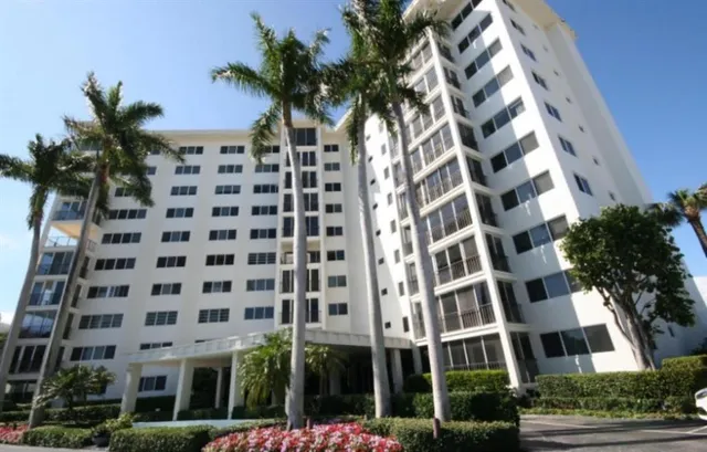 a swimming pool view with a garden space