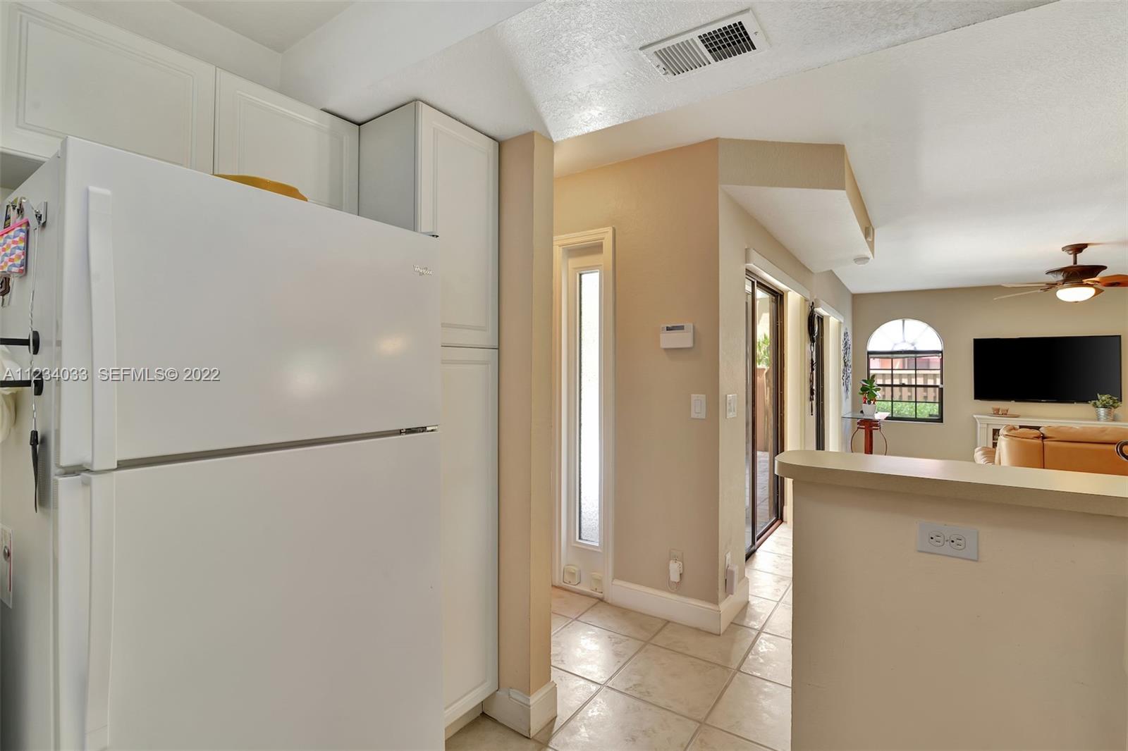8171 Thames Boulevard, Unit A Boca Raton, FL 33433 - Photo 15 of 34 a kitchen with stainless steel appliances a refrigerator and a sink