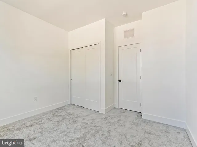 a bathroom with a sink a toilet and shower curtain