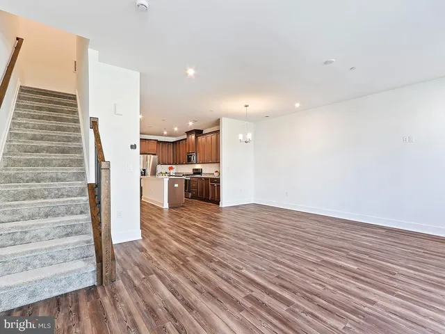 a view of kitchen living room with wooden floor