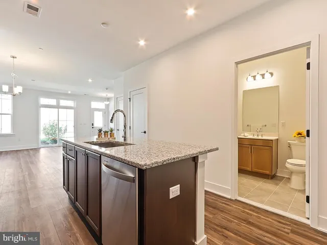 a kitchen with sink and cabinets