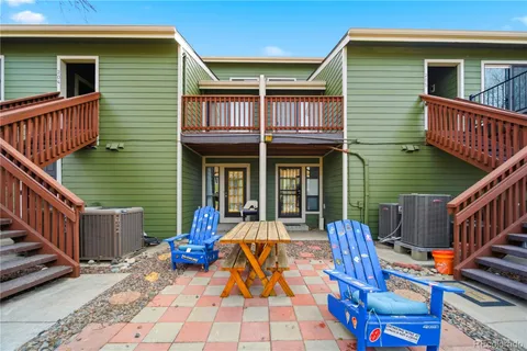 a view of a house with wooden deck