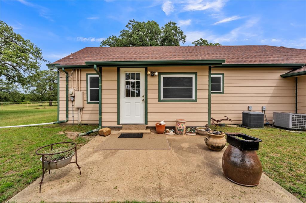 209 Dixie Road Millsap, TX 76066 - Photo 12 of 31 a backyard of a house with outdoor seating