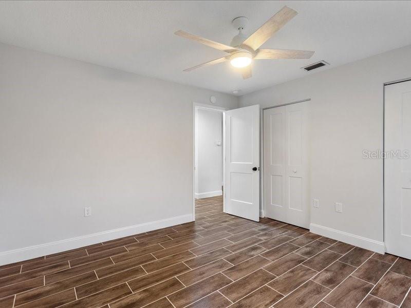 1941 Settlement Road, Unit 11 Venice, FL 34285 - Photo 22 of 39 wooden floor in an empty room