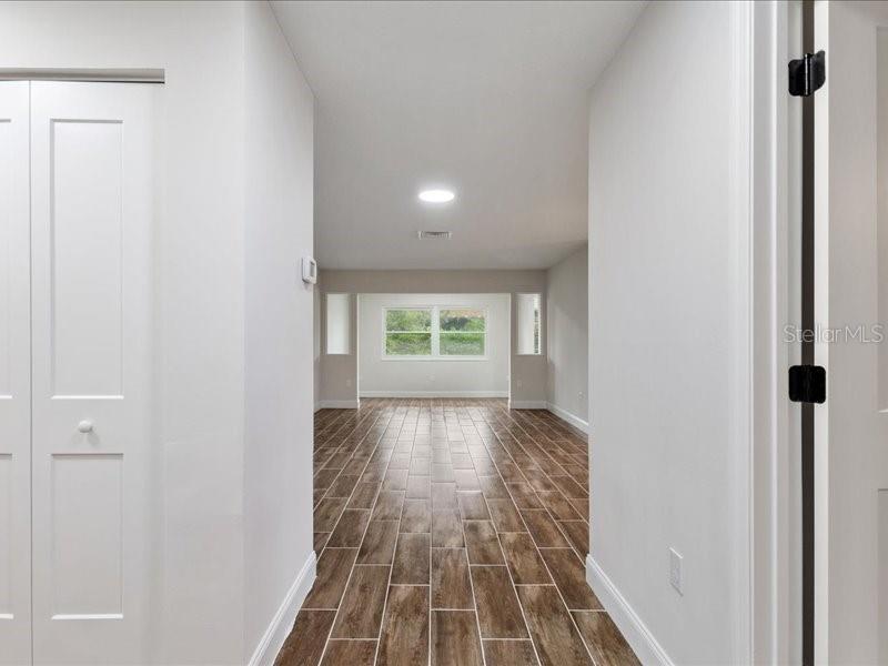 1941 Settlement Road, Unit 11 Venice, FL 34285 - Photo 24 of 39 a view of a room with wooden floor and a window