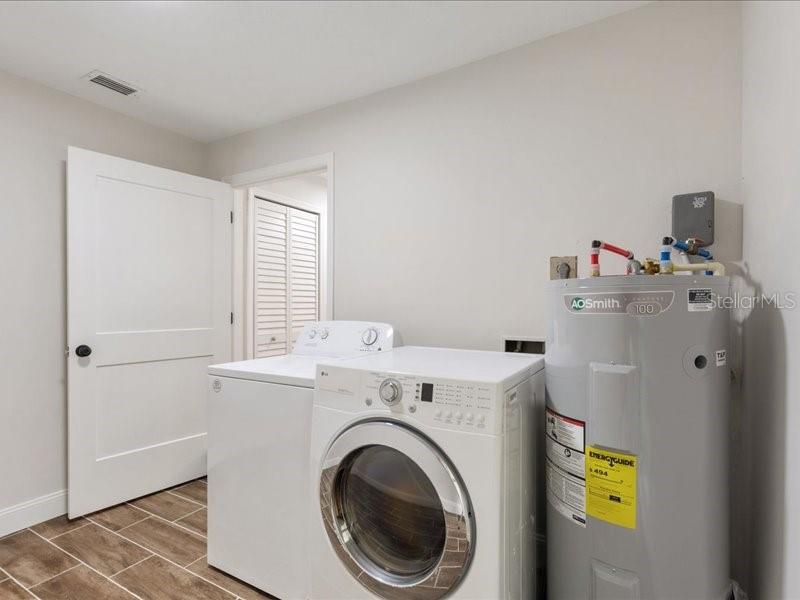 1941 Settlement Road, Unit 11 Venice, FL 34285 - Photo 27 of 39 a utility room with dryer and washer