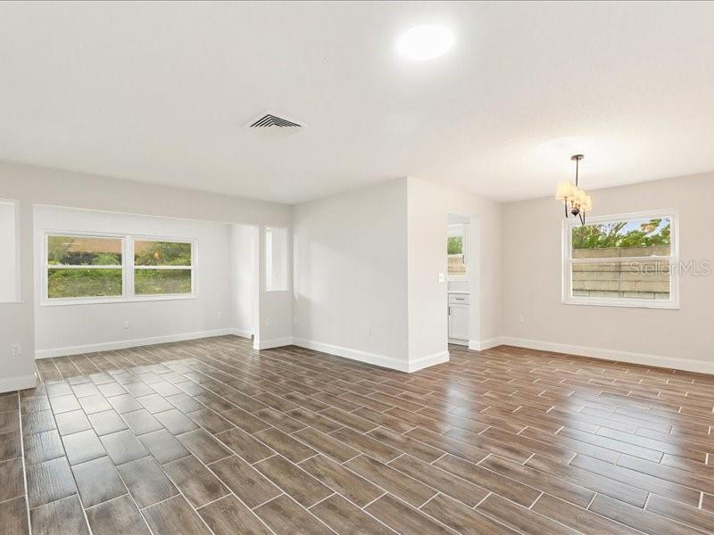 1941 Settlement Road, Unit 11 Venice, FL 34285 - Photo 5 of 39 an empty room with windows