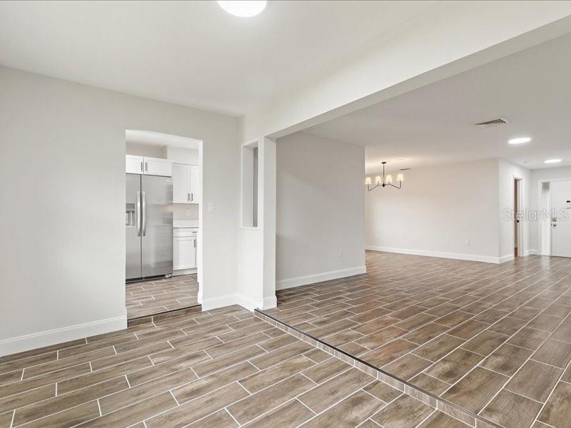 1941 Settlement Road, Unit 11 Venice, FL 34285 - Photo 8 of 39 a view of a livingroom with wooden floor and a bathroom