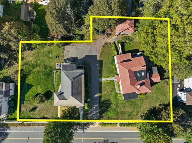 an aerial view of house with a swimming pool