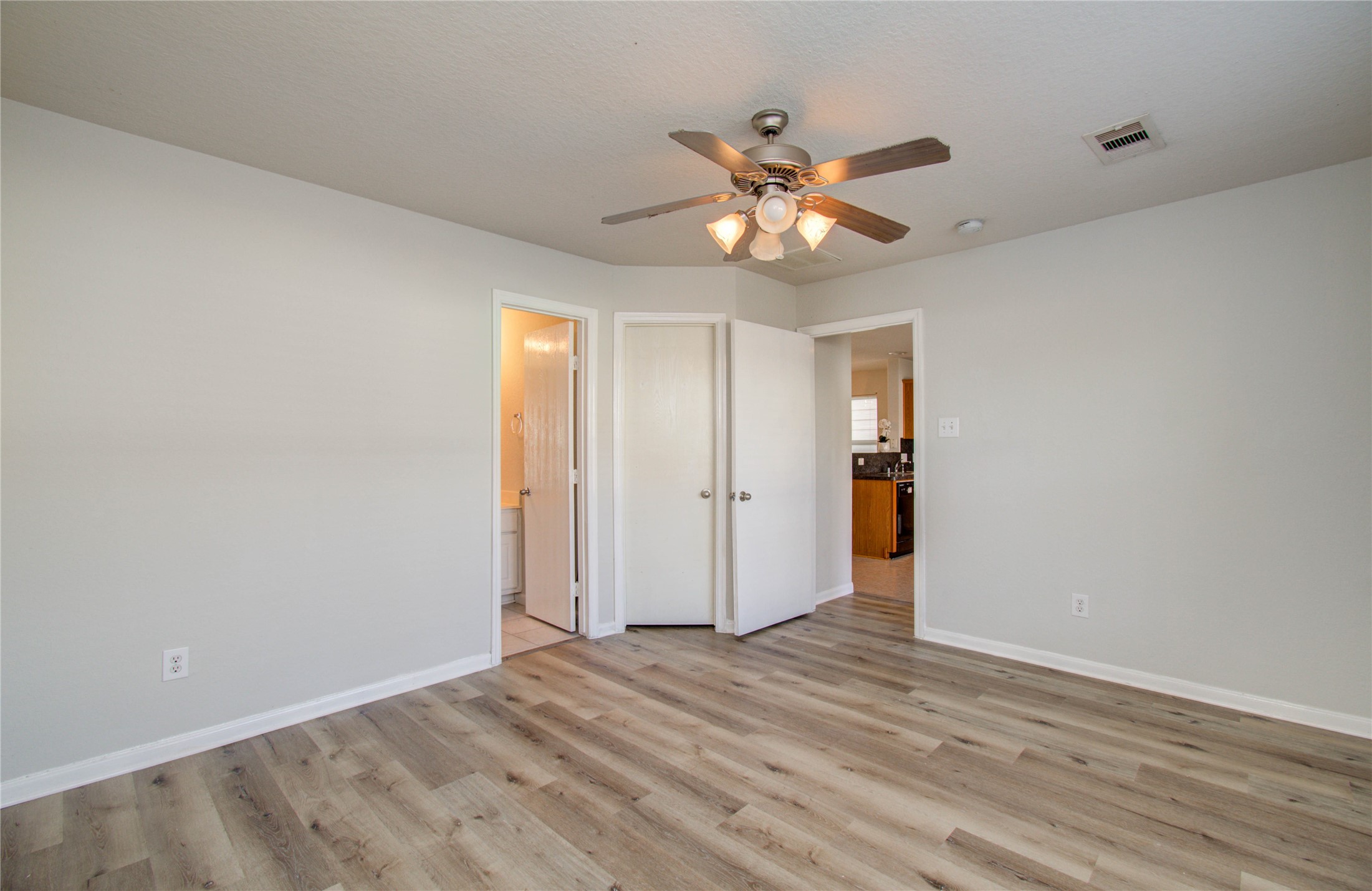 13231 Ridgewood Knoll Lane Houston, TX 77047 - Photo 14 of 23 a view of an empty room with wooden floor