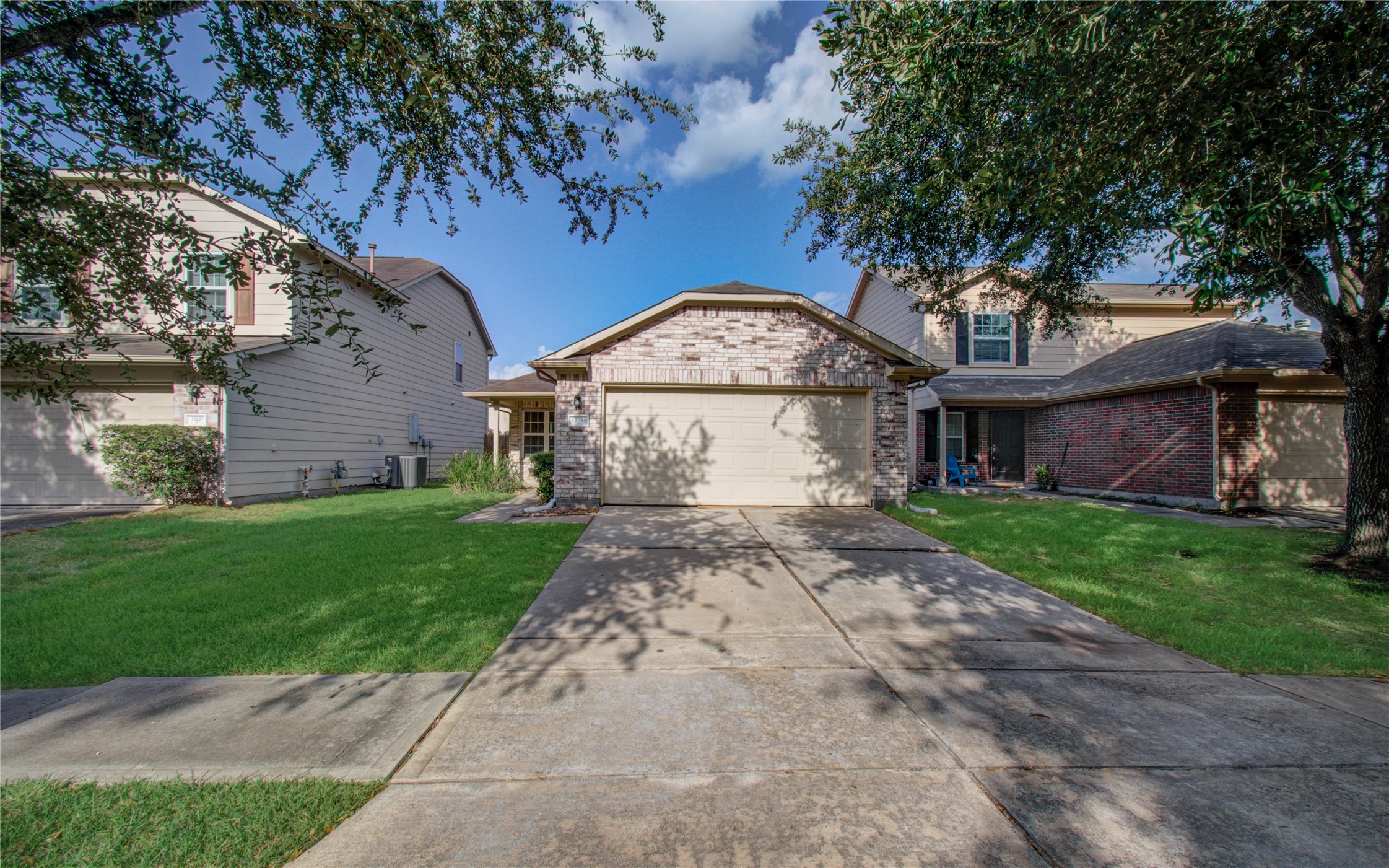 13231 Ridgewood Knoll Lane Houston, TX 77047 - Photo 2 of 23 a view of a house with a yard and a large tree