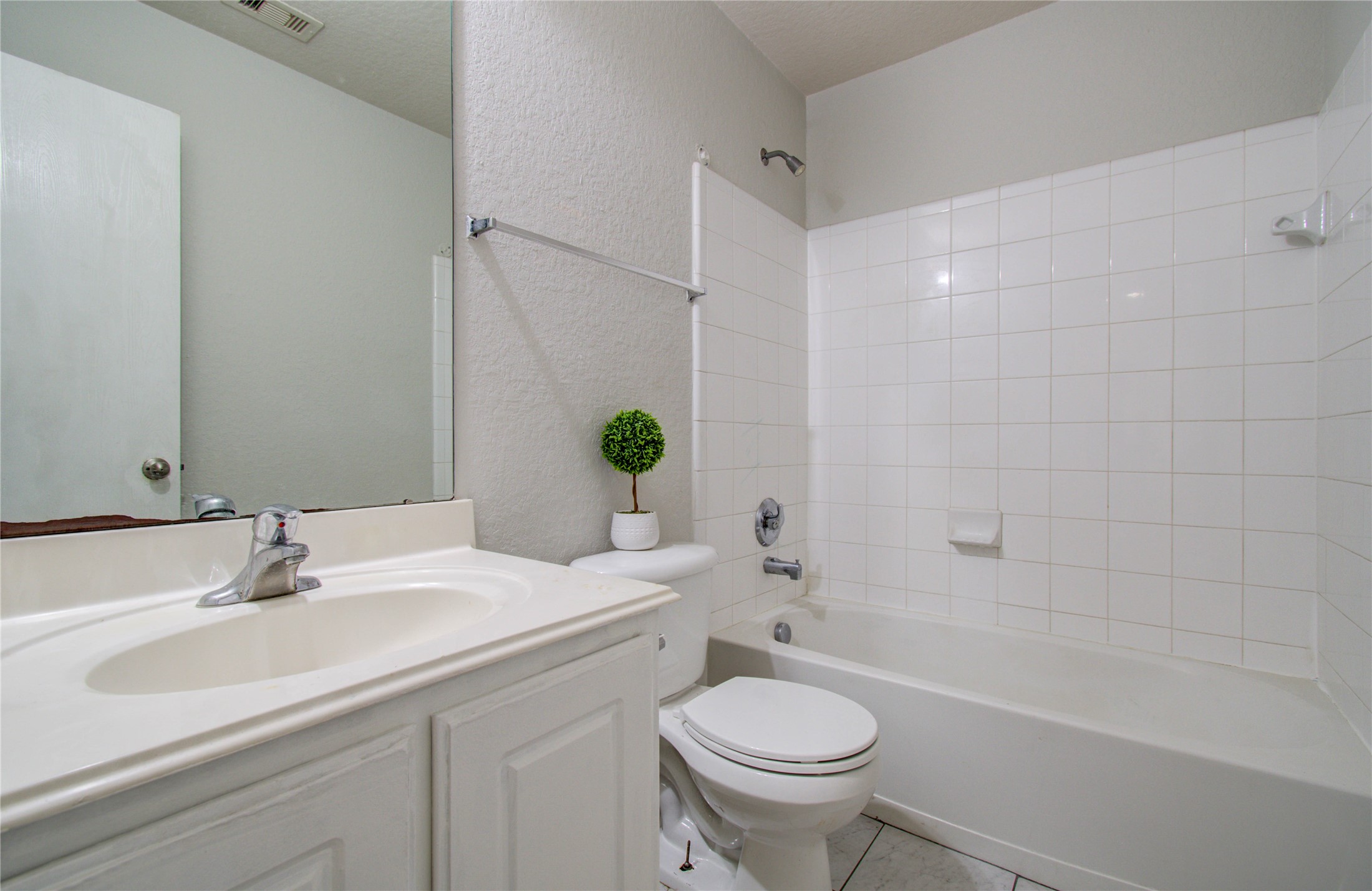 13231 Ridgewood Knoll Lane Houston, TX 77047 - Photo 21 of 23 a bathroom with a sink a toilet and shower